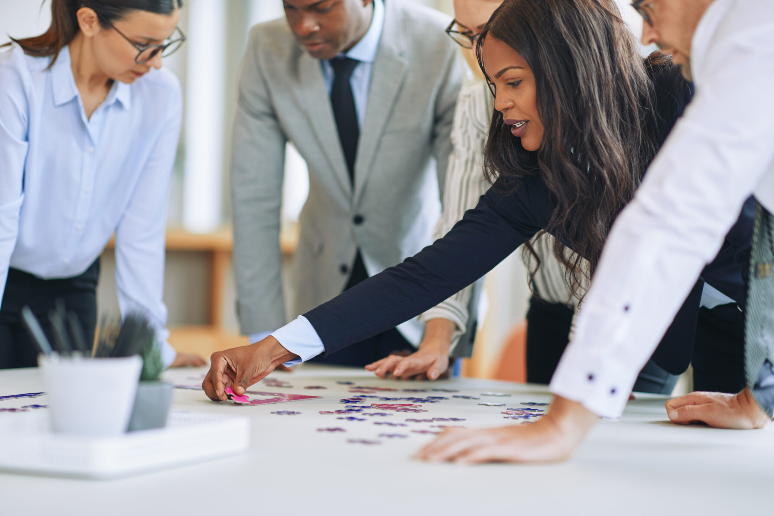 A team of lead generation strategists trying to solve a complicated puzzle